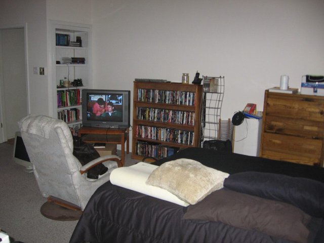 My bed in relation to the TV/DVD player/rack. Still a bit messy.