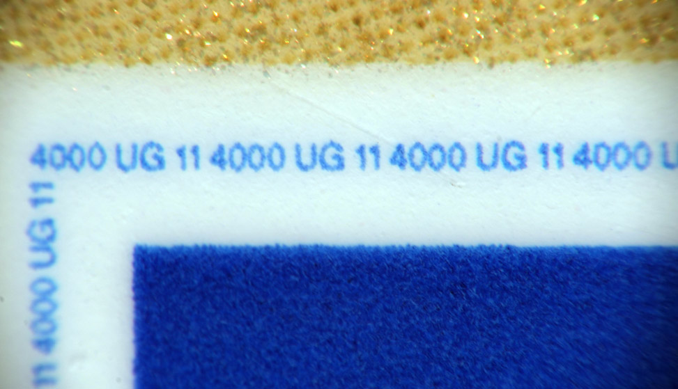 The same blue line around the logo, 50mm + 70-300mm @ 300mm.