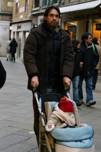 Candid street photography.  He doesn't look pleased.