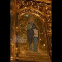 A close up view of one of the saints in the altar.