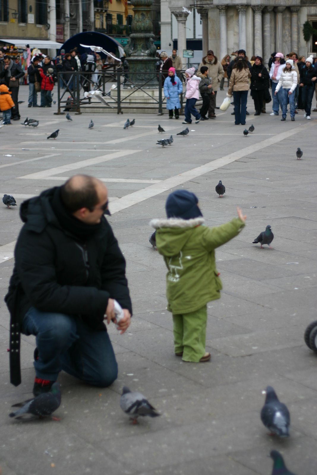 A little kid waving.