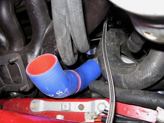 The convoluted method of running intercooler piping around everything else in the vicinity.