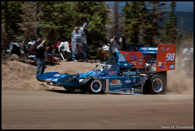 Dallenbach's car coming out of the turn, running slightly.