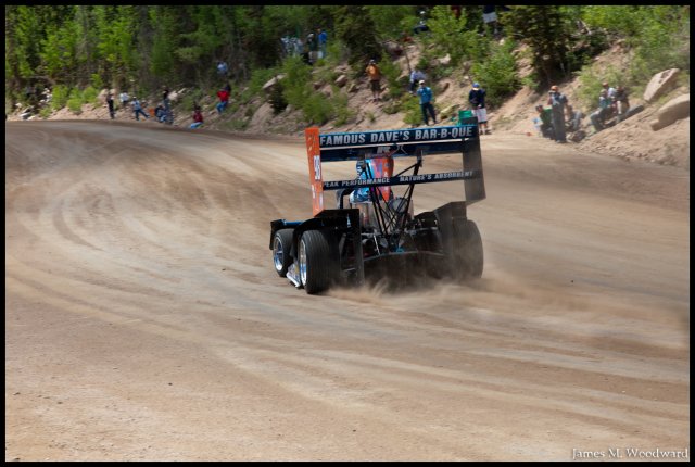 Dallenbach's car getting up the straight, 2.